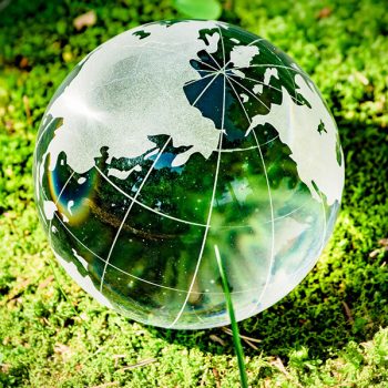 Many children hands holding planet earth isolated on blue background with copy space. Element of this image furnished by NASA ( https://earthobservatory.nasa.gov/blogs/elegantfigures/2011/10/06/crafting-the-blue-marble/ )